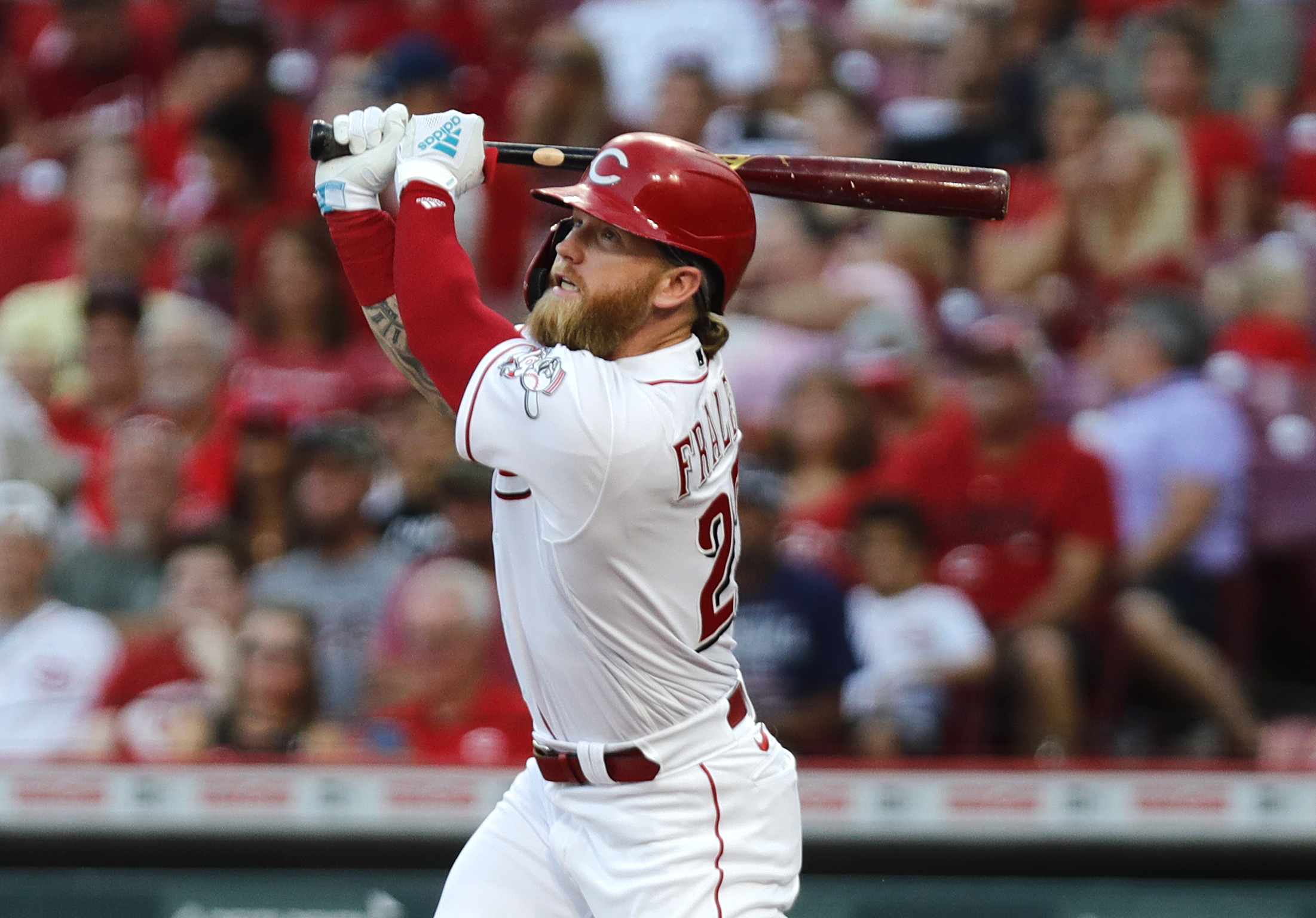 Aug 30, 2022; Cincinnati, Ohio, USA; Cincinnati Reds designated hitter Jake Fraley (27) hits an RBI double against the St. Louis Cardinals during the third inning at Great American Ball Park.