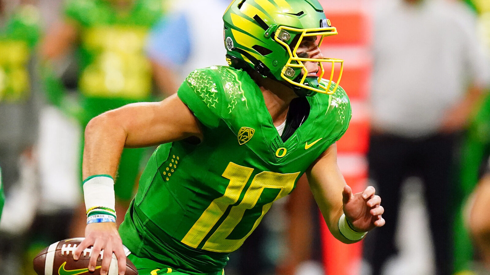 Oregon Ducks quarterback Bo Nix (10) scrambles out against the Georgia Bulldogs during the third quarter of the Chick-fil-A kickoff game at Mercedes-Benz Stadium.