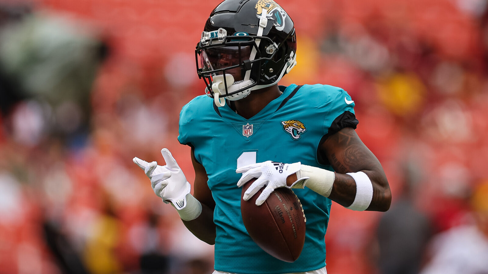 Jacksonville Jaguars running back Travis Etienne Jr. (1) warms up before the game against the Washington Commanders at FedExField.