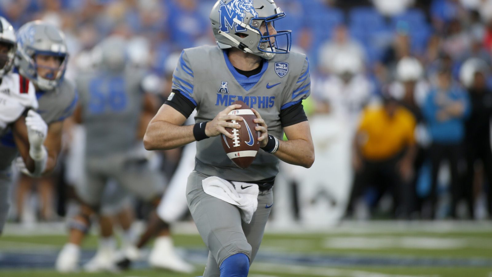 Sep 17, 2022; Memphis, Tennessee, USA; Memphis Tigers quarterback Seth Henigan (5) scrambles during the first half against the Arkansas State Red Wolves at Liberty Bowl Memorial Stadium.