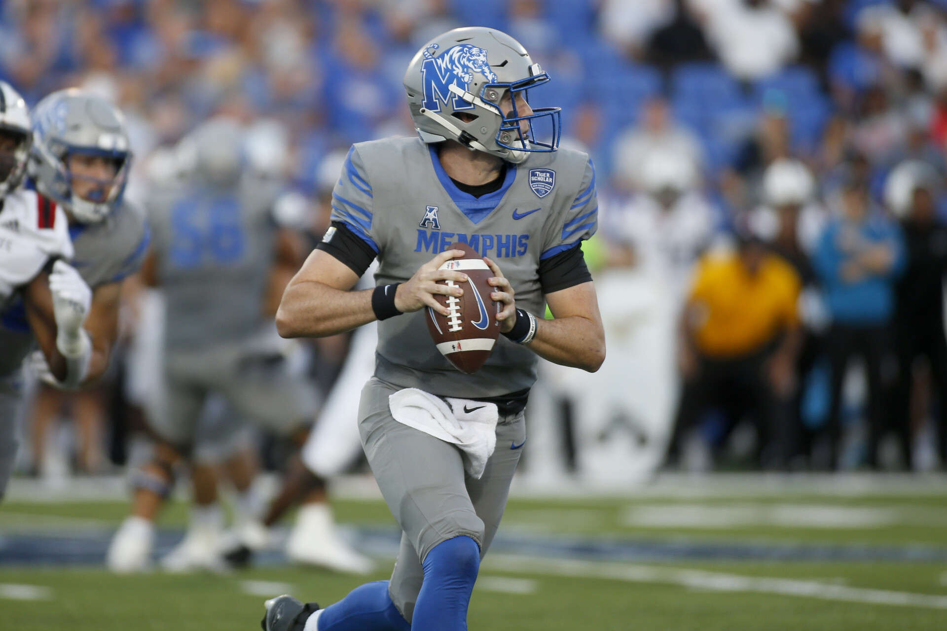 Sep 17, 2022; Memphis, Tennessee, USA; Memphis Tigers quarterback Seth Henigan (5) scrambles during the first half against the Arkansas State Red Wolves at Liberty Bowl Memorial Stadium.