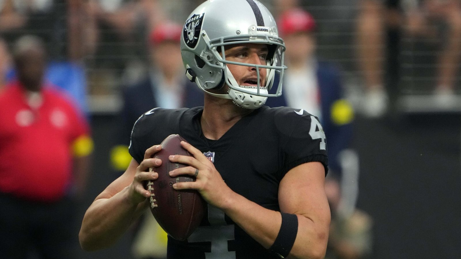 Sep 18, 2022; Paradise, Nevada, USA; Las Vegas Raiders quarterback Derek Carr (4) throws the ball against the Arizona Cardinals in the second half at Allegiant Stadium.