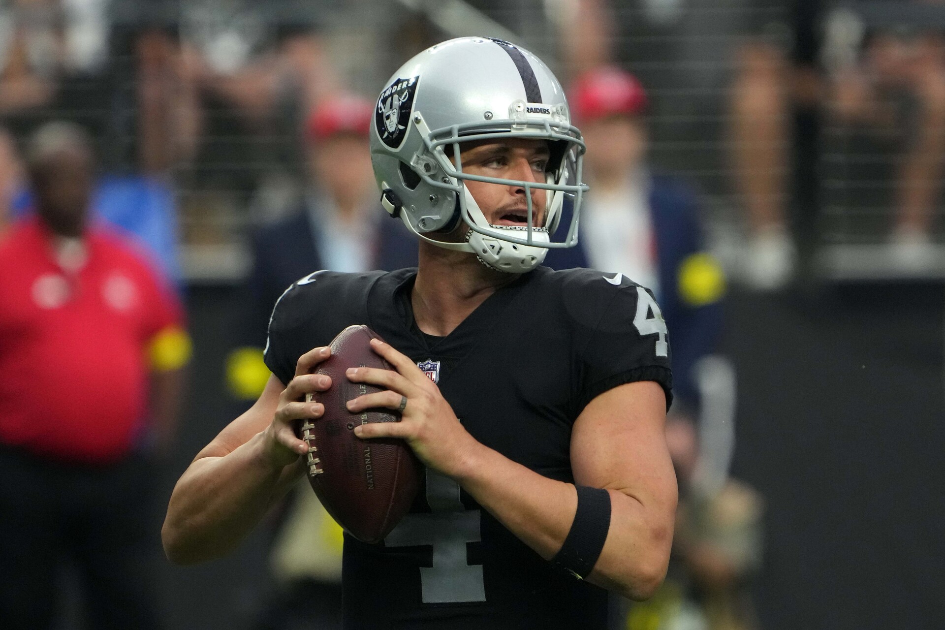 Sep 18, 2022; Paradise, Nevada, USA; Las Vegas Raiders quarterback Derek Carr (4) throws the ball against the Arizona Cardinals in the second half at Allegiant Stadium.
