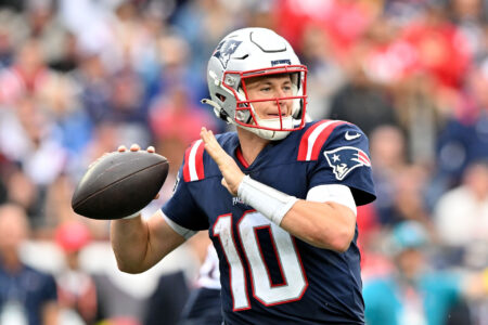 New England Patriots quarterback Mac Jones (10) throws the ball against the Baltimore Ravens during the second half at Gillette Stadium.