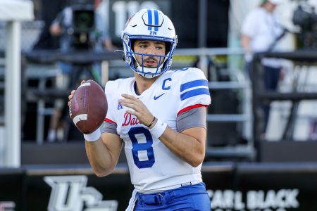 1Oct 5, 2022; Orlando, Florida, USA; Southern Methodist Mustangs quarterback Tanner Mordecai (8) warms up before a game against the UCF Knights at FBC Mortgage Stadium.