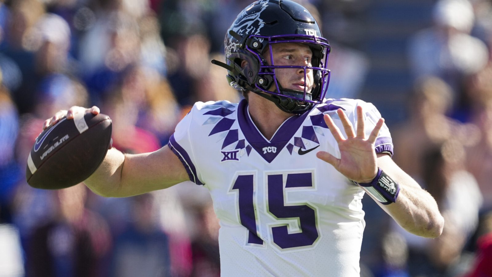 TCU Horned Frogs quarterback Max Duggan (15) throws a pass during the first half against the Kansas Jayhawks at David Booth Kansas Memorial Stadium.