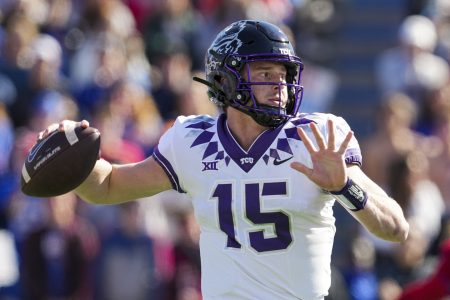 TCU Horned Frogs quarterback Max Duggan (15) throws a pass during the first half against the Kansas Jayhawks at David Booth Kansas Memorial Stadium.