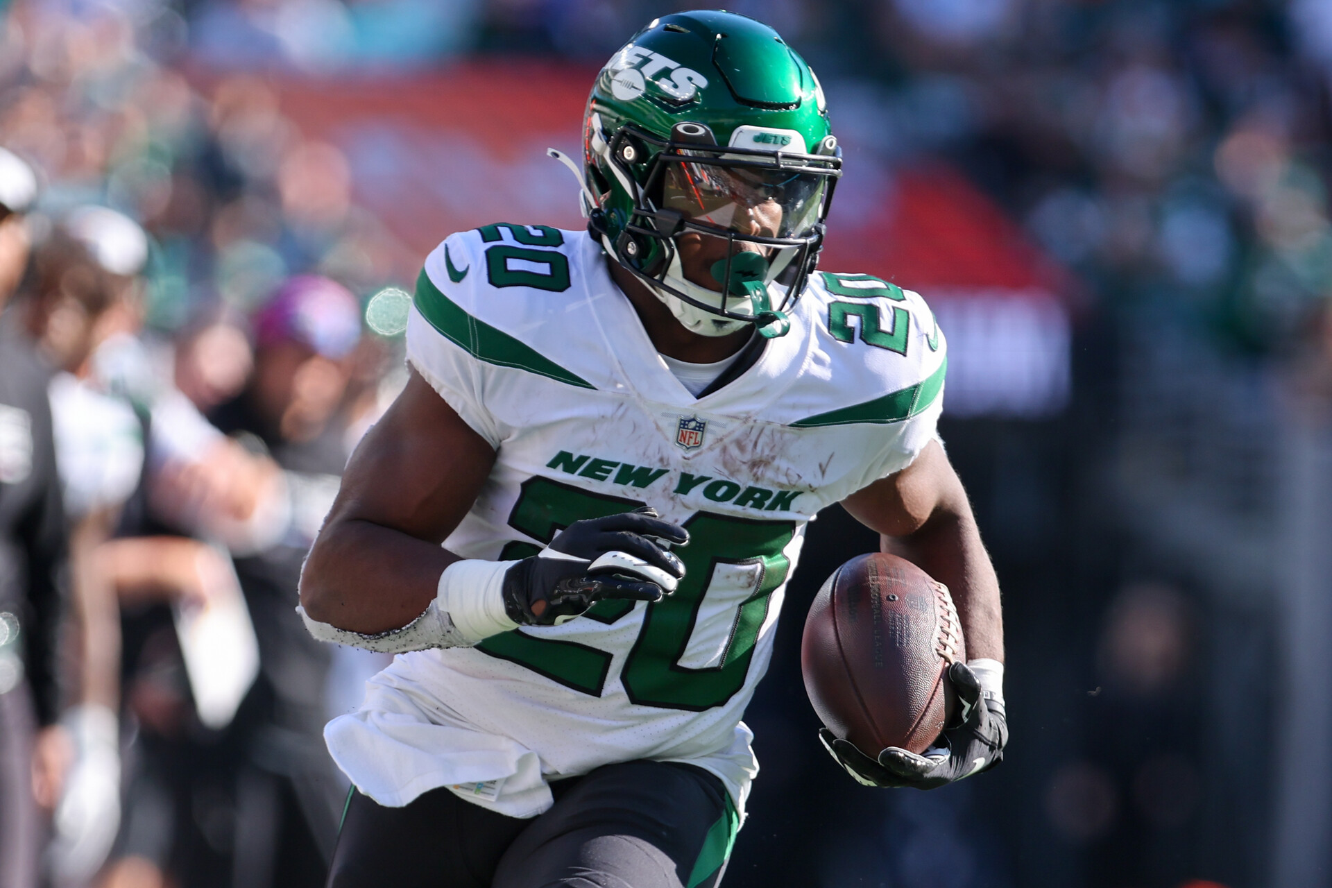 Oct 9, 2022; East Rutherford, New Jersey, USA; New York Jets running back Breece Hall (20) runs with the ball against the Miami Dolphins during the second half at MetLife Stadium.