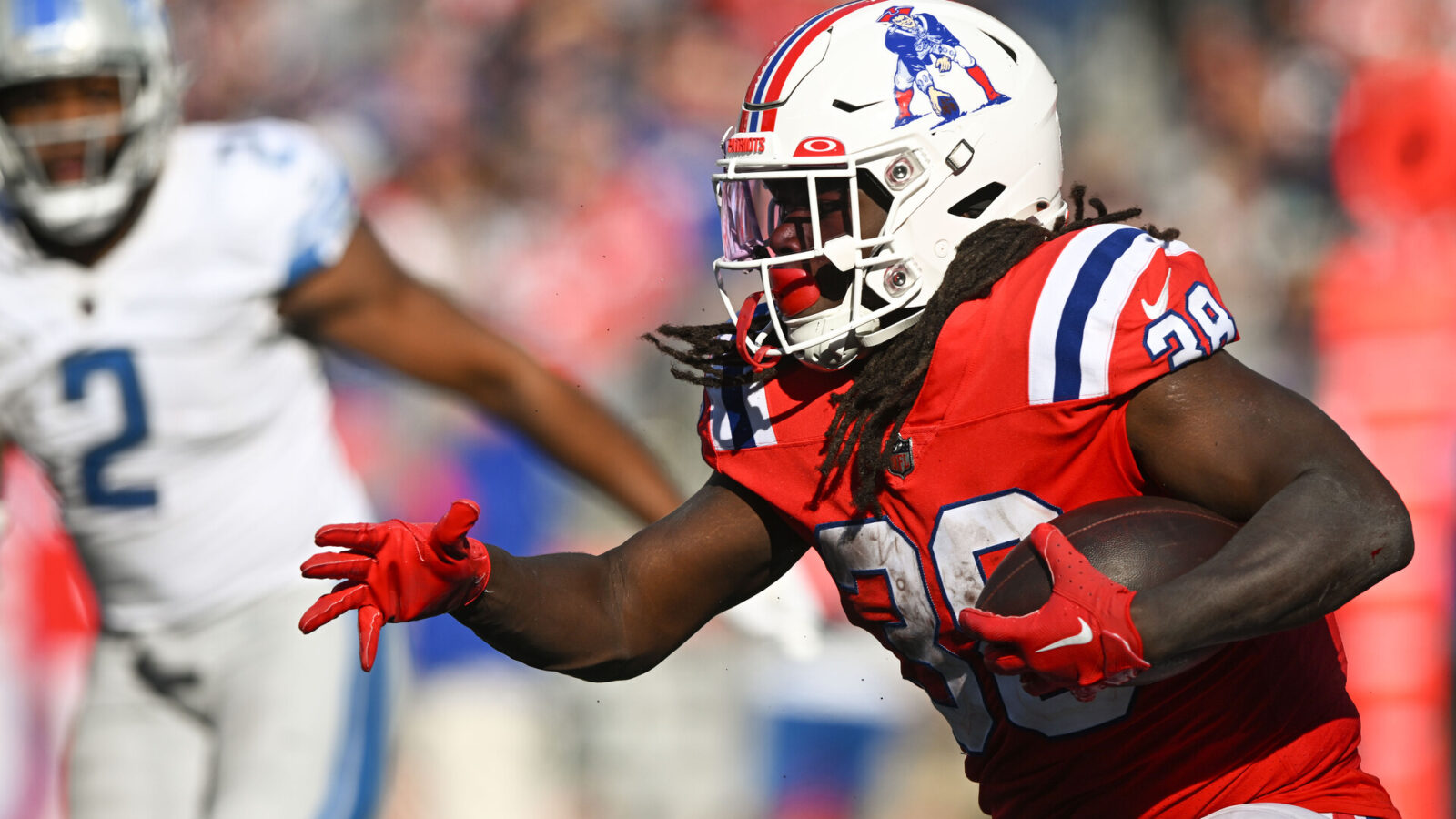 Oct 9, 2022; Foxborough, Massachusetts, USA; New England Patriots running back Rhamondre Stevenson (38) runs with the ball against the Detroit Lions during the second half at Gillette Stadium.