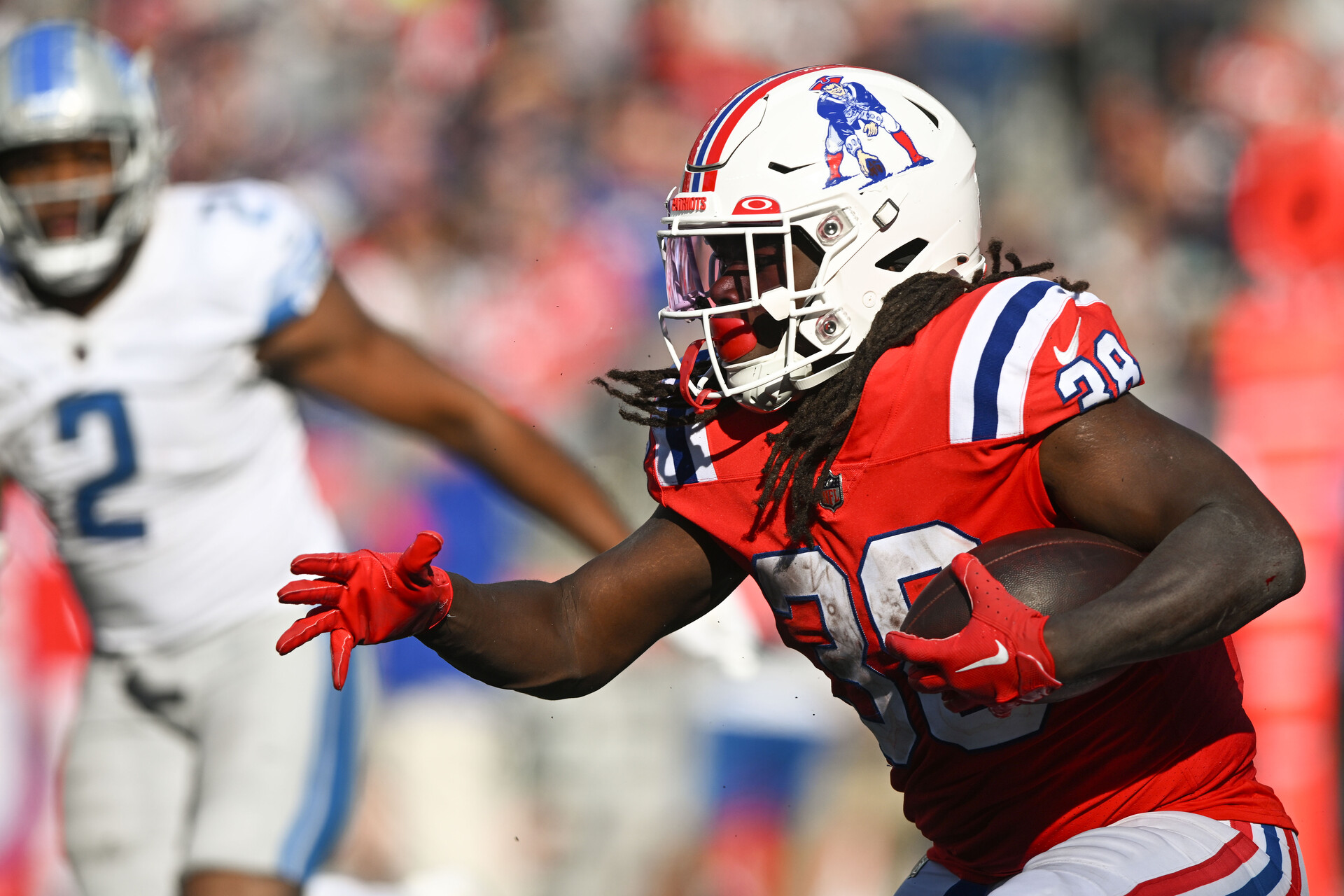 Oct 9, 2022; Foxborough, Massachusetts, USA; New England Patriots running back Rhamondre Stevenson (38) runs with the ball against the Detroit Lions during the second half at Gillette Stadium.