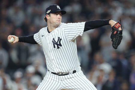 Oct 11, 2022; Bronx, New York, USA; New York Yankees starting pitcher Gerrit Cole (45) throws a pitch during the first inning in game one of the ALDS against the Cleveland Guardians for the 2022 MLB Playoffs at Yankee Stadium.