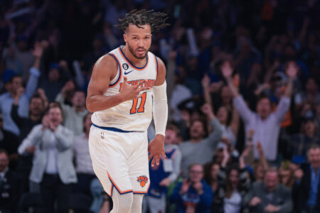 New York Knicks guard Jalen Brunson (11) reacts after making a three point basket during the fourth quarter against the Charlotte Hornets at Madison Square Garden.