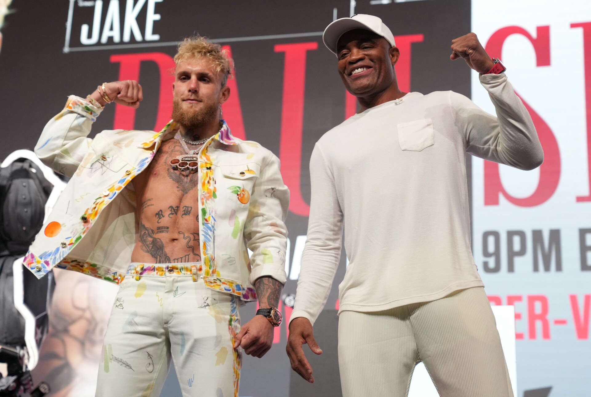 Jake Paul and Anderson Silva pose for photos during a news conference at Desert Diamond Arena on Thursday, Oct. 27, 2022 to preview their Saturday night fight.
