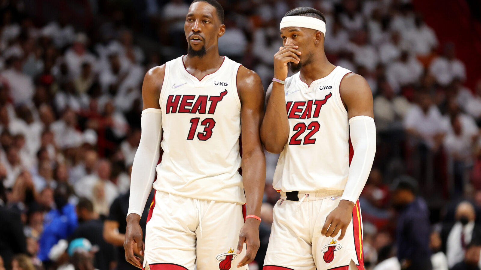 Bam Adebayo #13 and Jimmy Butler #22 of the Miami Heat talk during the second quarter against the Boston Celtics in Game Two of the 2022 NBA Playoffs Eastern Conference Finals at FTX Arena on May 19, 2022 in Miami, Florida.