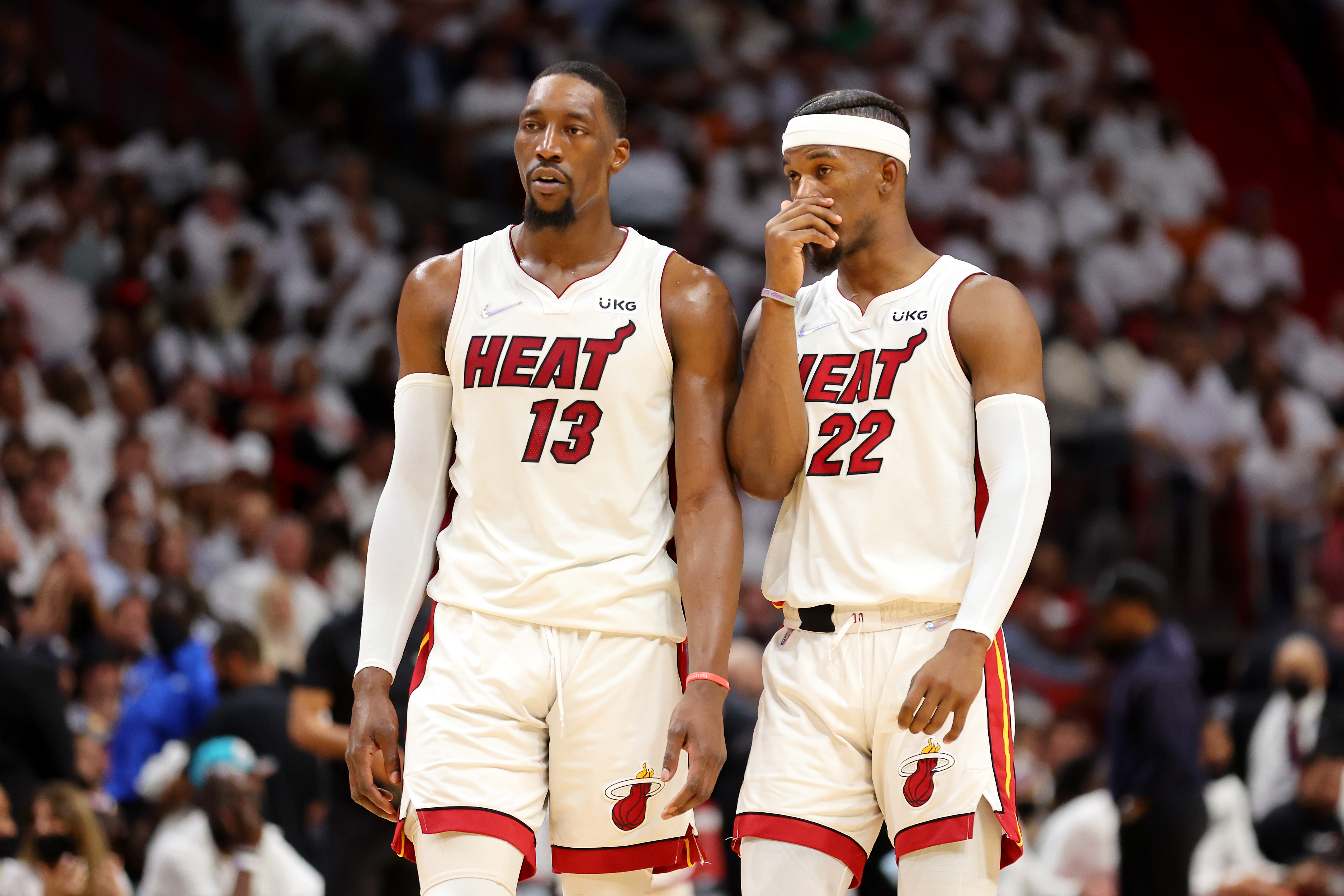 Bam Adebayo #13 and Jimmy Butler #22 of the Miami Heat talk during the second quarter against the Boston Celtics in Game Two of the 2022 NBA Playoffs Eastern Conference Finals at FTX Arena on May 19, 2022 in Miami, Florida.