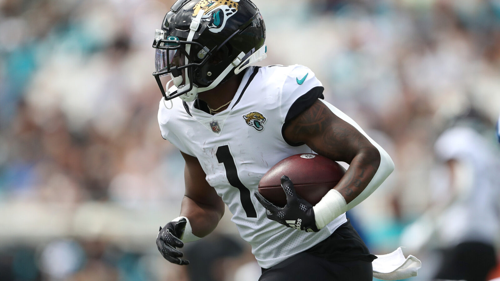 Travis Etienne Jr. #1 of the Jacksonville Jaguars runs the ball during the first half against the Indianapolis Colts at TIAA Bank Field on September 18, 2022 in Jacksonville, Florida.