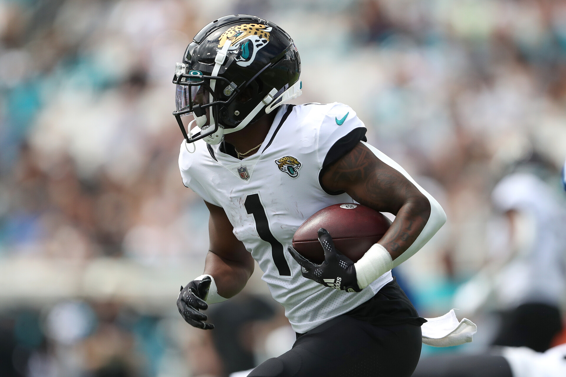 Travis Etienne Jr. #1 of the Jacksonville Jaguars runs the ball during the first half against the Indianapolis Colts at TIAA Bank Field on September 18, 2022 in Jacksonville, Florida.