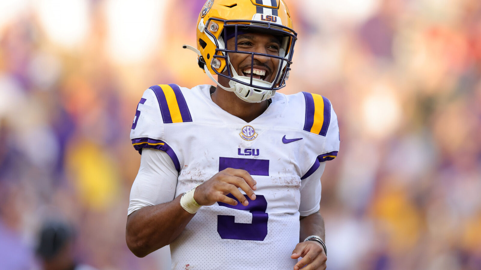 Jayden Daniels #5 of the LSU Tigers celebrates a touchdown during the second half against the Mississippi Rebels at Tiger Stadium on October 22, 2022 in Baton Rouge, Louisiana.