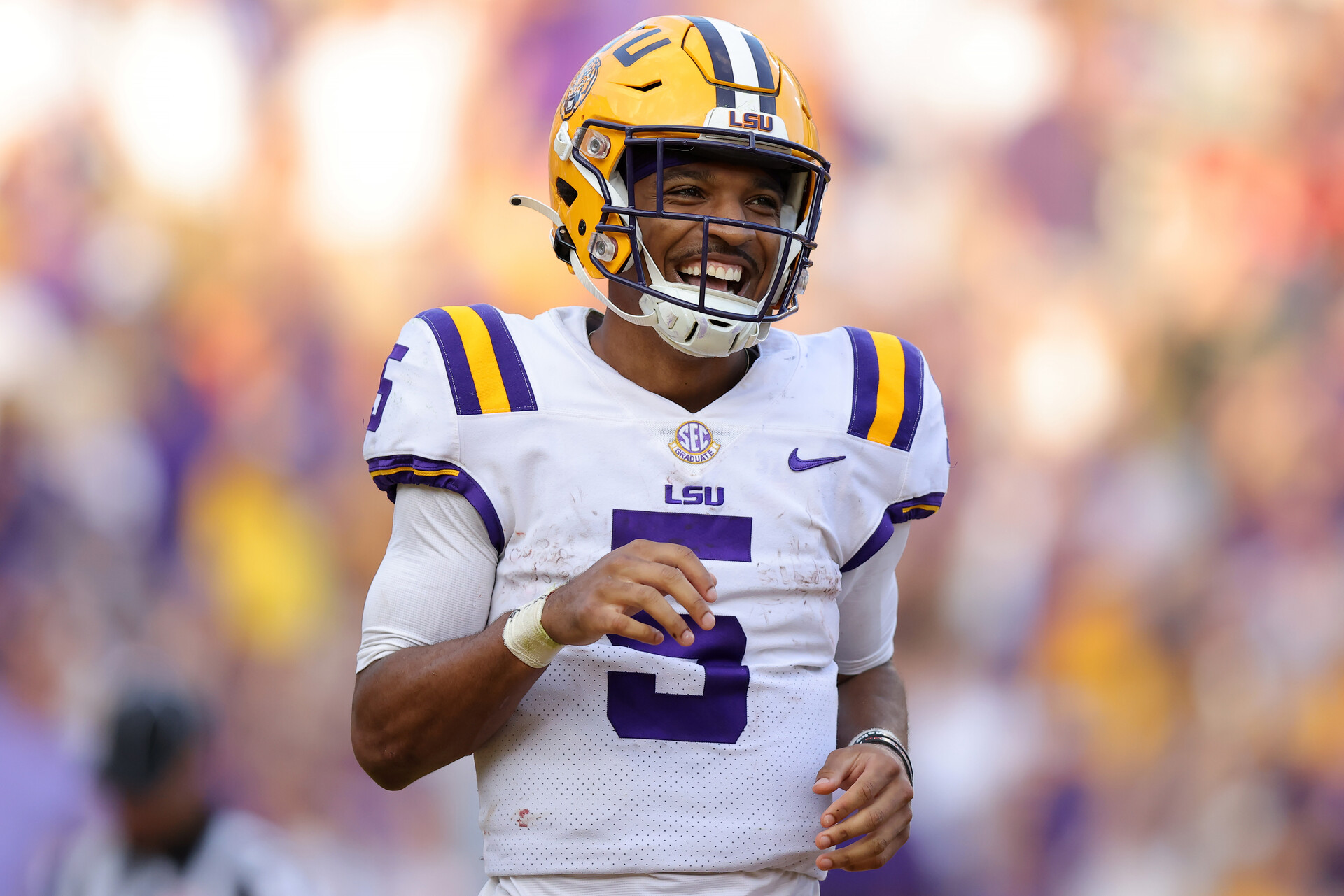 Jayden Daniels #5 of the LSU Tigers celebrates a touchdown during the second half against the Mississippi Rebels at Tiger Stadium on October 22, 2022 in Baton Rouge, Louisiana.
