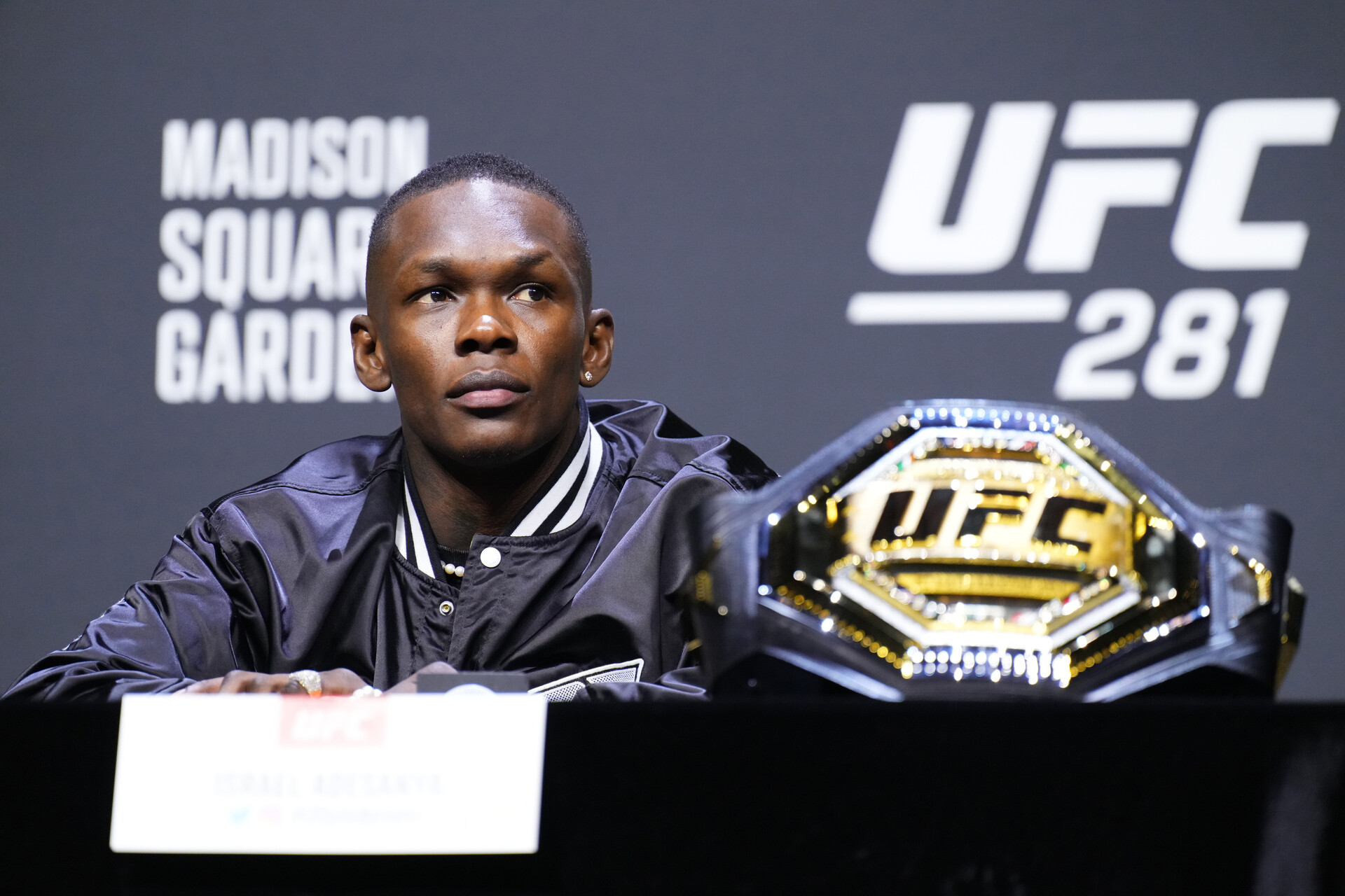 UFC DFS Apps - Israel Adesanya of Nigeria is seen on stage during the UFC 281 press conference at Madison Square Garden on November 09, 2022 in New York City.
