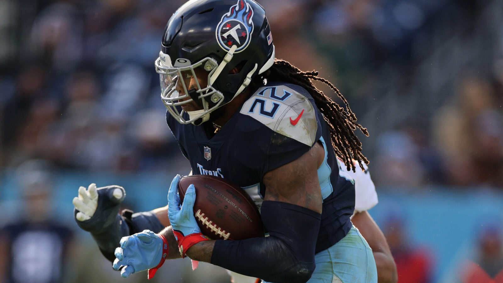 Derrick Henry #22 of the Tennessee Titans runs the ball during the third quarter against the Denver Broncos at Nissan Stadium on November 13, 2022 in Nashville, Tennessee.