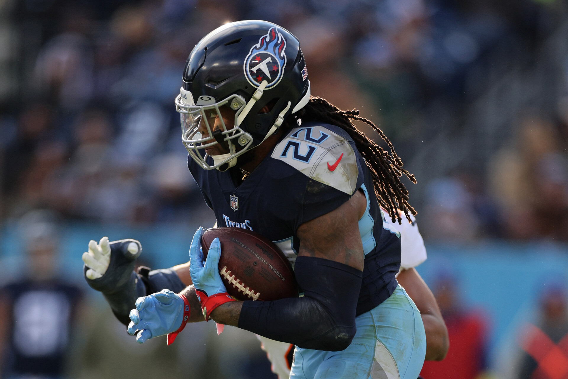 Derrick Henry #22 of the Tennessee Titans runs the ball during the third quarter against the Denver Broncos at Nissan Stadium on November 13, 2022 in Nashville, Tennessee.