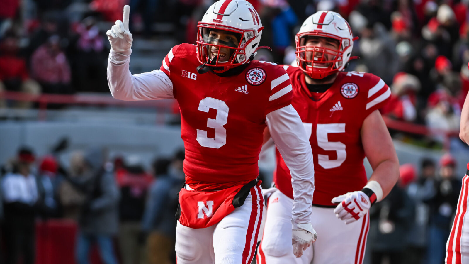 Wide receiver Trey Palmer #3 of the Nebraska Cornhuskers celebrates a score with offensive lineman Trent Hixson #75 against the Wisconsin Badgers during the third quarter at Memorial Stadium on November 19, 2022 in Lincoln, Nebraska.