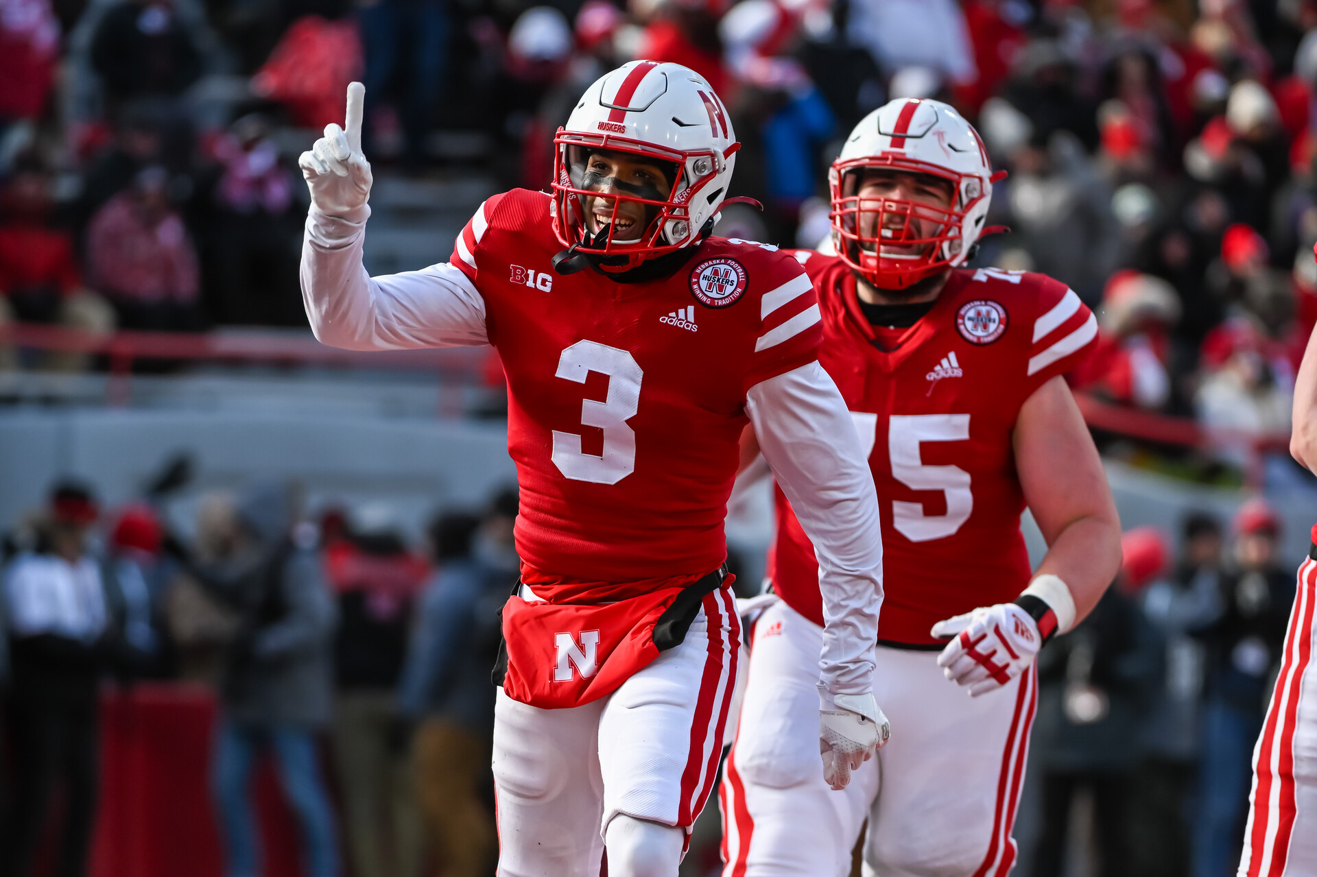 Wide receiver Trey Palmer #3 of the Nebraska Cornhuskers celebrates a score with offensive lineman Trent Hixson #75 against the Wisconsin Badgers during the third quarter at Memorial Stadium on November 19, 2022 in Lincoln, Nebraska.