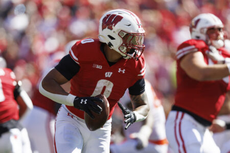 Wisconsin Badgers running back Braelon Allen (0) looks to throw a pass during the second quarter against the Illinois Fighting Illini at Camp Randall Stadium.