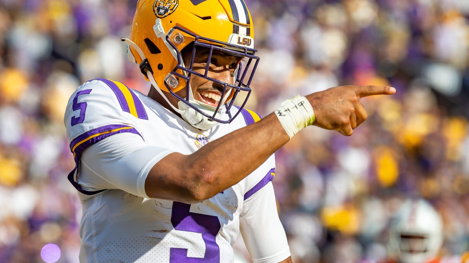 Quarterback Jayden Daniels celebrates after scoring a touchdown as the LSU Tigers take on the Ole Miss Rebels at Tiger Stadium in Baton Rouge, Louisiana, USA.Saturday October 22, 2022.
