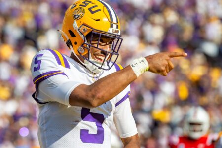 Quarterback Jayden Daniels celebrates after scoring a touchdown as the LSU Tigers take on the Ole Miss Rebels at Tiger Stadium in Baton Rouge, Louisiana, USA.Saturday October 22, 2022.