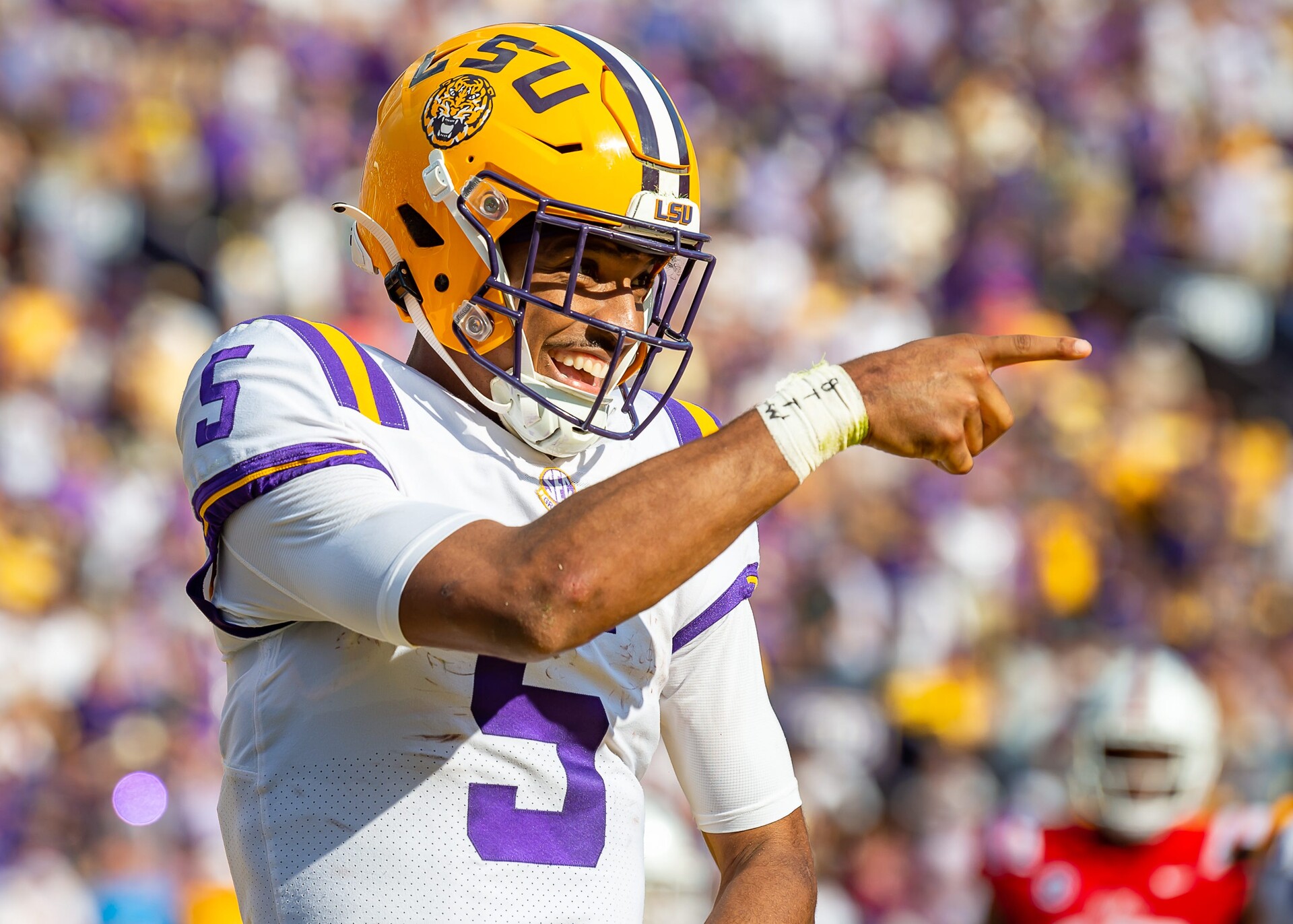 Quarterback Jayden Daniels celebrates after scoring a touchdown as the LSU Tigers take on the Ole Miss Rebels at Tiger Stadium in Baton Rouge, Louisiana, USA.Saturday October 22, 2022.