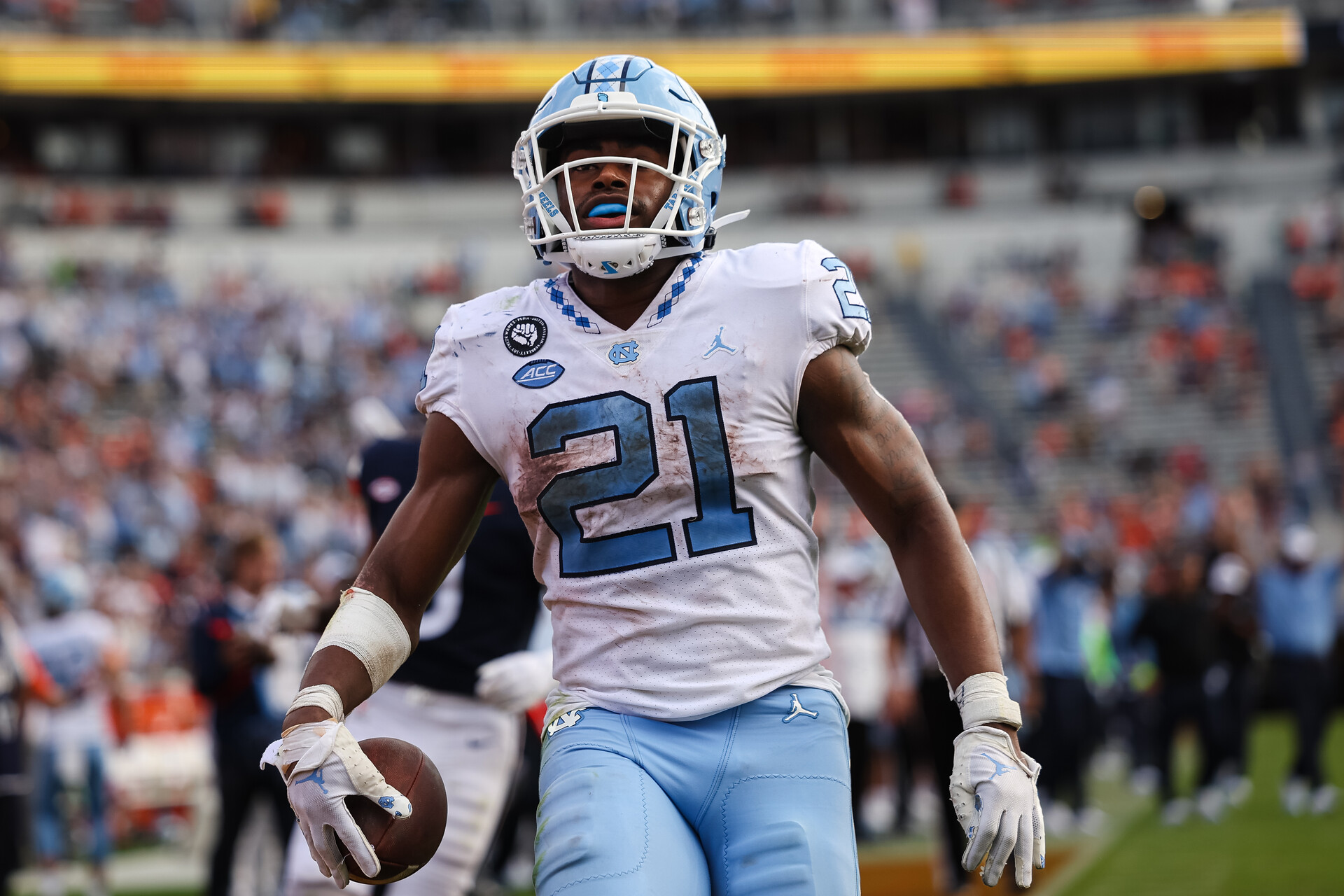 Nov 5, 2022; Charlottesville, Virginia, USA; North Carolina Tar Heels running back Elijah Green (21) runs for a touchdown against the Virginia Cavaliers during the second half at Scott Stadium.