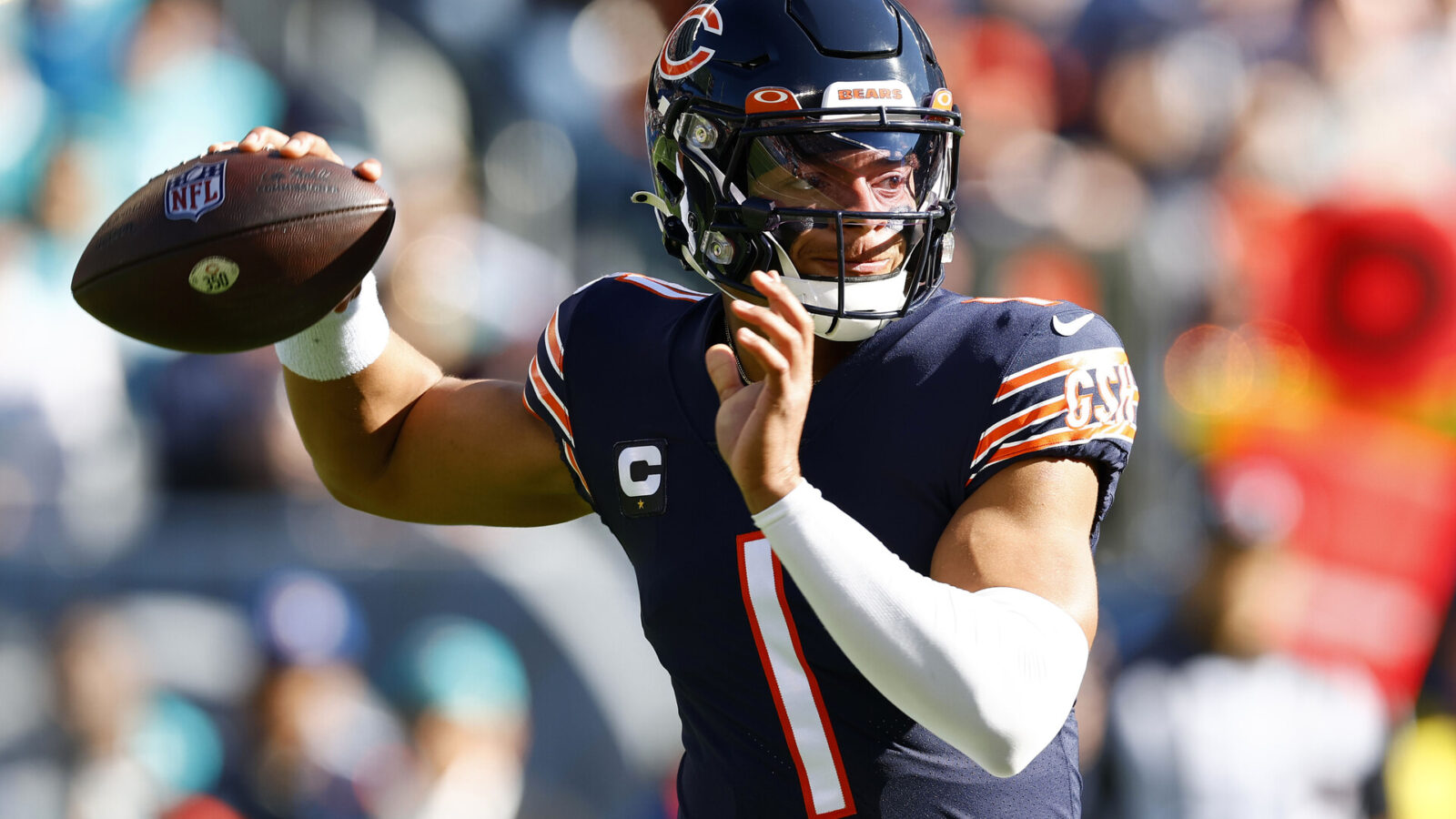 Chicago Bears quarterback Justin Fields (1) drops back to pass against the Miami Dolphins during the first quarter at Soldier Field.