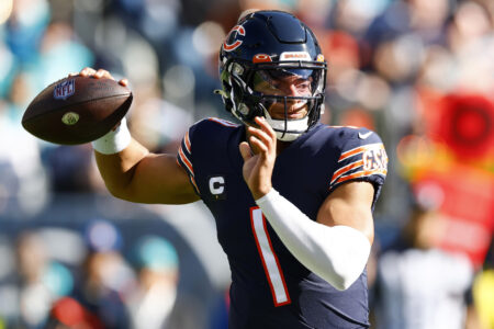 Chicago Bears quarterback Justin Fields (1) drops back to pass against the Miami Dolphins during the first quarter at Soldier Field.