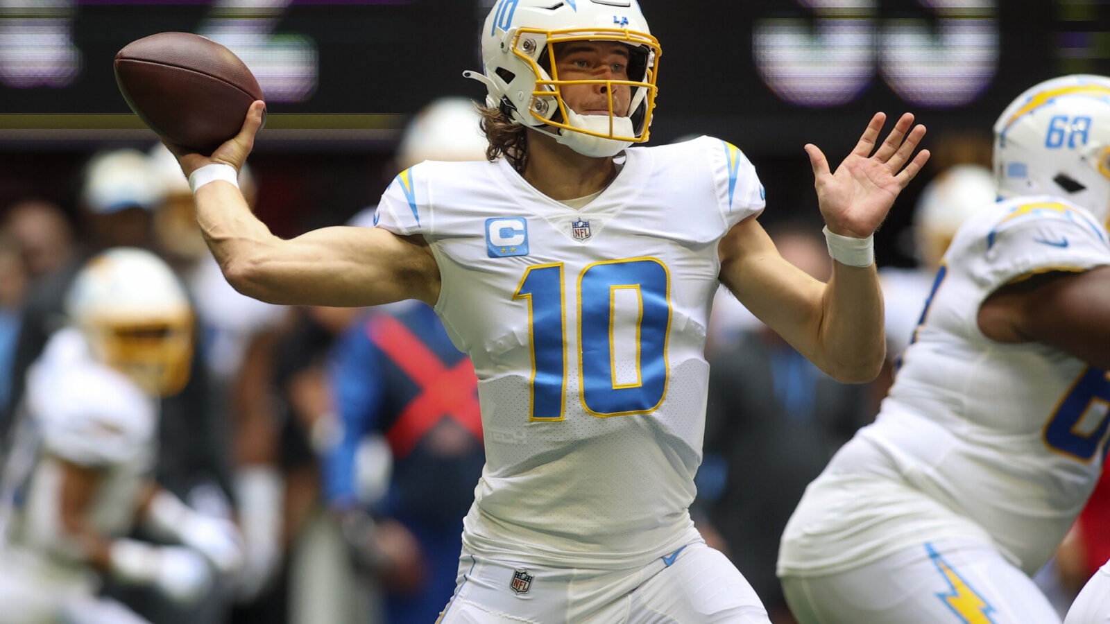 Nov 6, 2022; Atlanta, Georgia, USA; Los Angeles Chargers quarterback Justin Herbert (10) throws a pass against the Atlanta Falcons in the first quarter at Mercedes-Benz Stadium.
