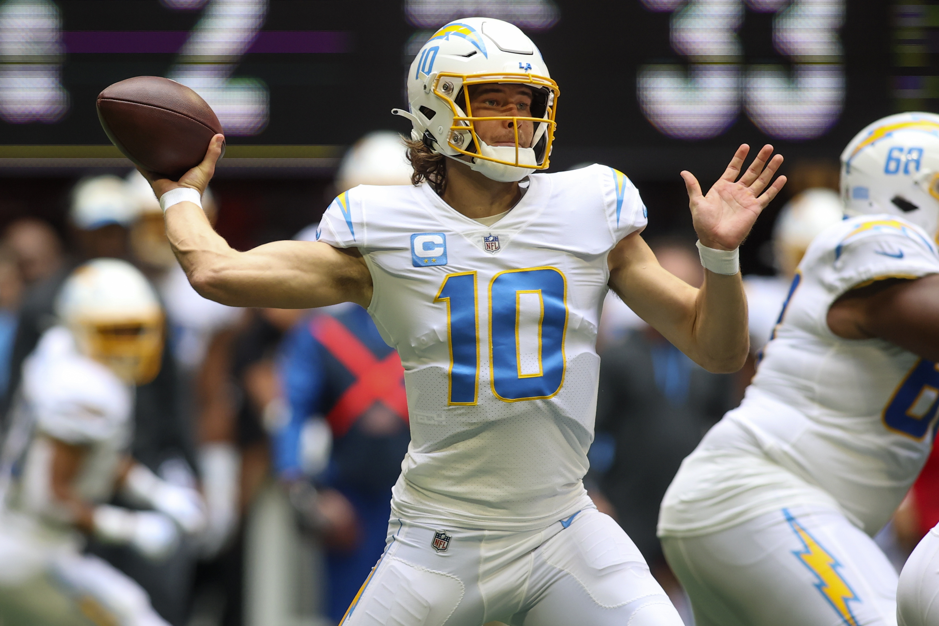 Nov 6, 2022; Atlanta, Georgia, USA; Los Angeles Chargers quarterback Justin Herbert (10) throws a pass against the Atlanta Falcons in the first quarter at Mercedes-Benz Stadium.