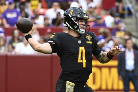 Nov 6, 2022; Landover, Maryland, USA; Washington Commanders quarterback Taylor Heinicke (4) attempts a pass against the Minnesota Vikings during the first half at FedExField.
