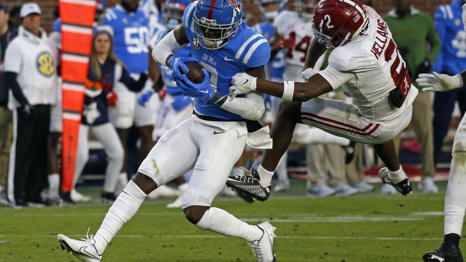 Nov 12, 2022; Oxford, Mississippi, USA; Mississippi Rebels wide receiver Malik Heath (8) runs after a catch as Alabama Crimson Tide running back Jase McClellan (2) attempts to make the tackle during the second half at Vaught-Hemingway Stadium.
