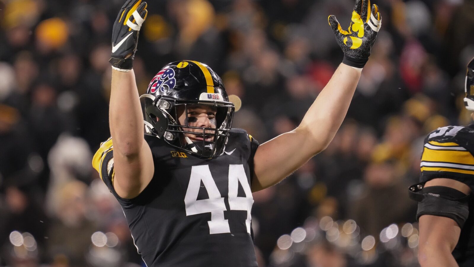 Iowa linebacker Seth Benson fires up the Hawkeyes home crowd in the third quarter against Wisconsin during a NCAA college football game in Iowa City on Saturday, Nov. 12, 2022.