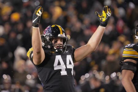 Iowa linebacker Seth Benson fires up the Hawkeyes home crowd in the third quarter against Wisconsin during a NCAA college football game in Iowa City on Saturday, Nov. 12, 2022.