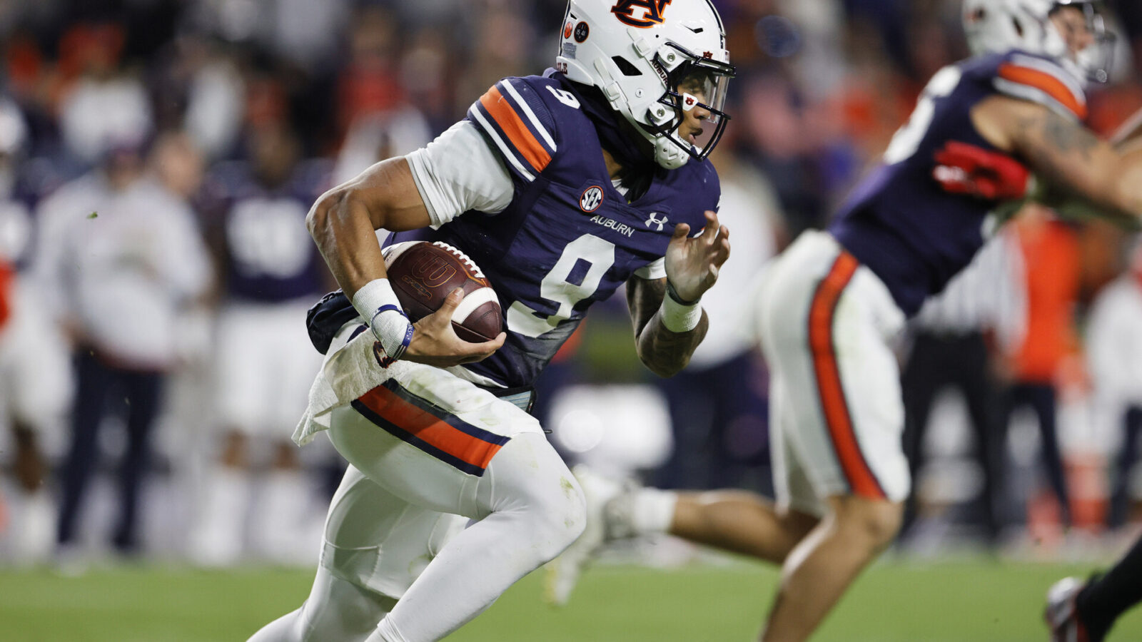 Nov 19, 2022; Auburn, Alabama, USA; Auburn Tigers quarterback Robby Ashford (9) scrambles for yardage during the third quarter against the Western Kentucky Hilltoppers at Jordan-Hare Stadium.