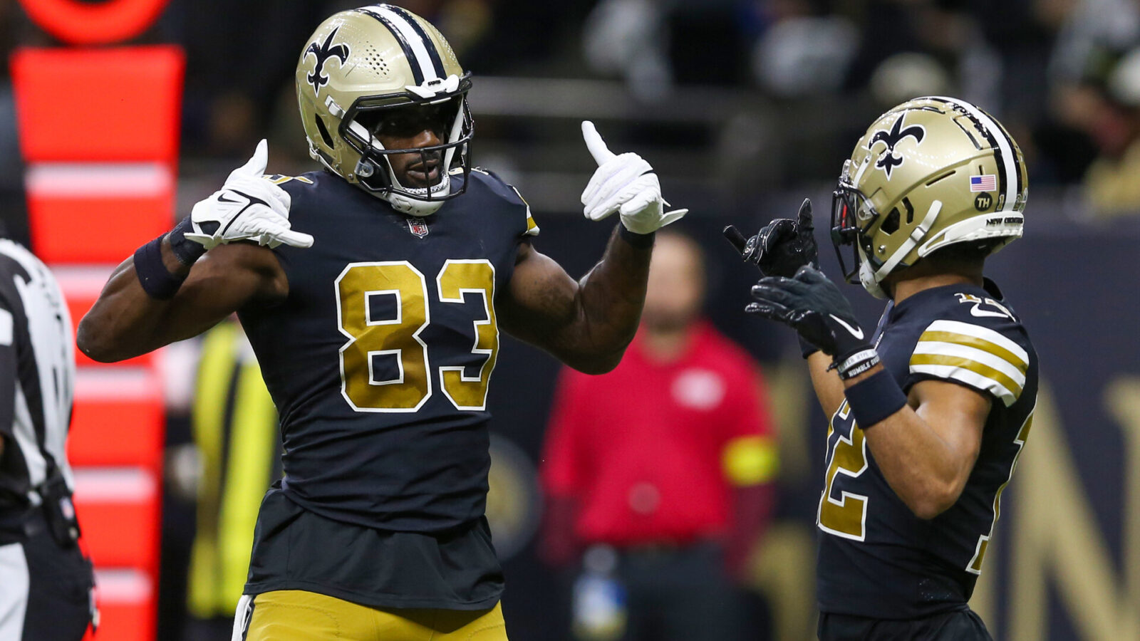 Nov 20, 2022; New Orleans, Louisiana, USA; New Orleans Saints tight end Juwan Johnson (83) celebrates his touchdown catch with wide receiver Chris Olave (12) in the second quarter against the Los Angeles Rams at the Caesars Superdome