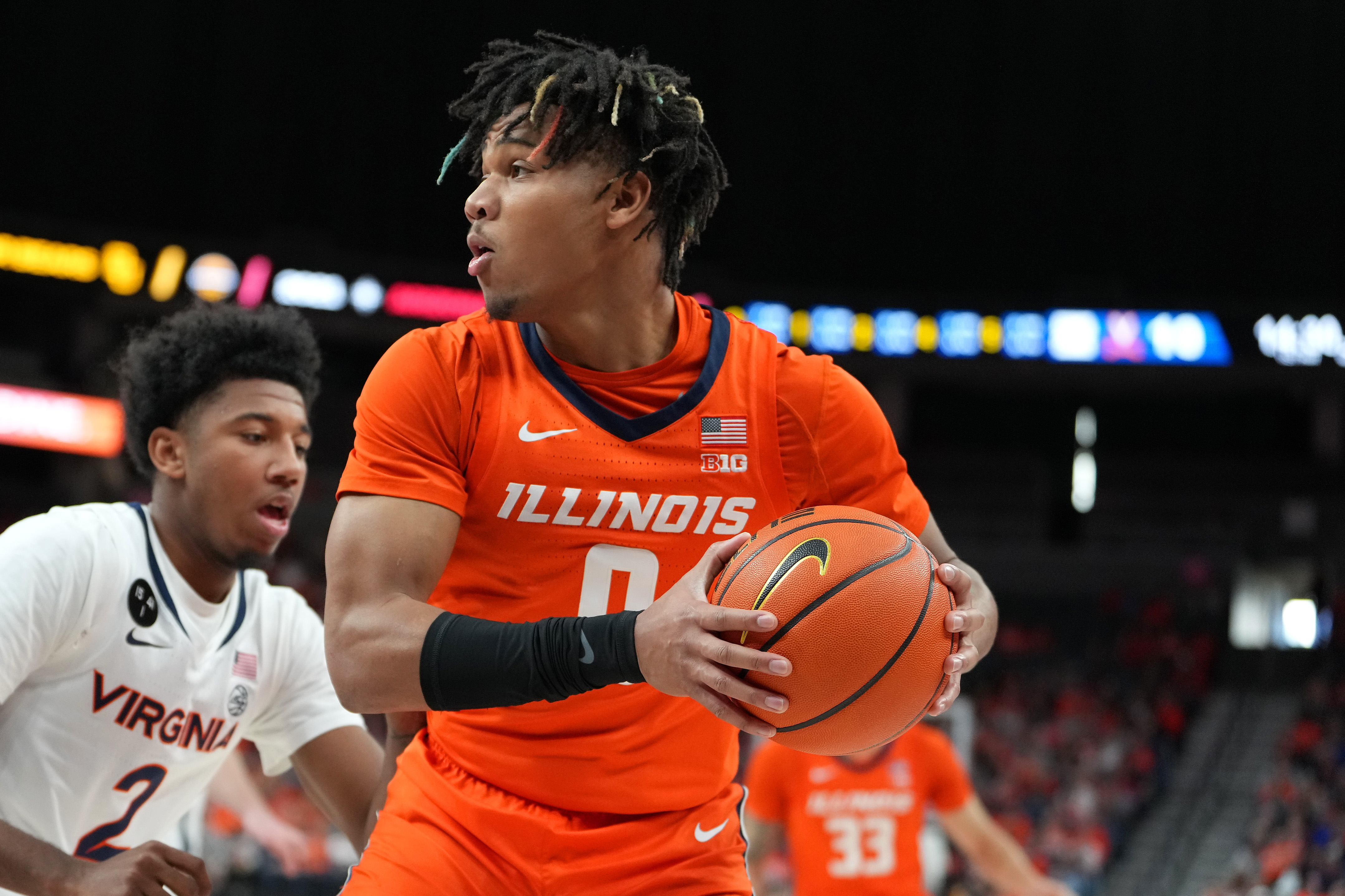 Illinois Fighting Illini guard Terrence Shannon Jr. (0) looks to pass the ball against the Virginia Cavaliers during the first half at T-Mobile Arena.