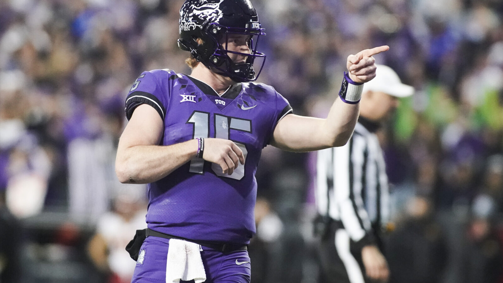 Nov 26, 2022; Fort Worth, Texas, USA; TCU Horned Frogs quarterback Max Duggan (15) points at his receiver after thrown a touchdown pass against the Iowa State Cyclones during second half at Amon G. Carter Stadium.