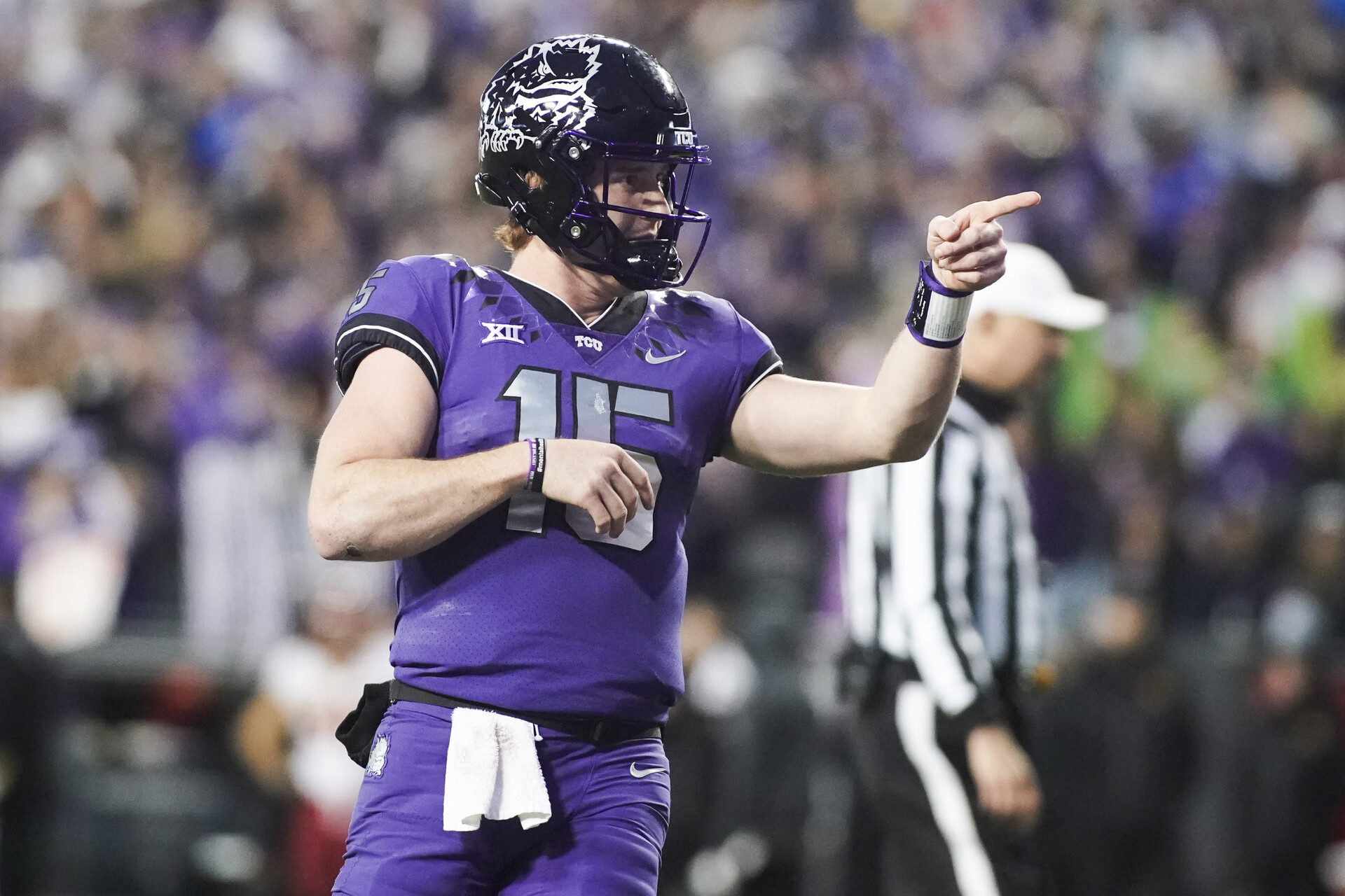 Nov 26, 2022; Fort Worth, Texas, USA; TCU Horned Frogs quarterback Max Duggan (15) points at his receiver after thrown a touchdown pass against the Iowa State Cyclones during second half at Amon G. Carter Stadium.