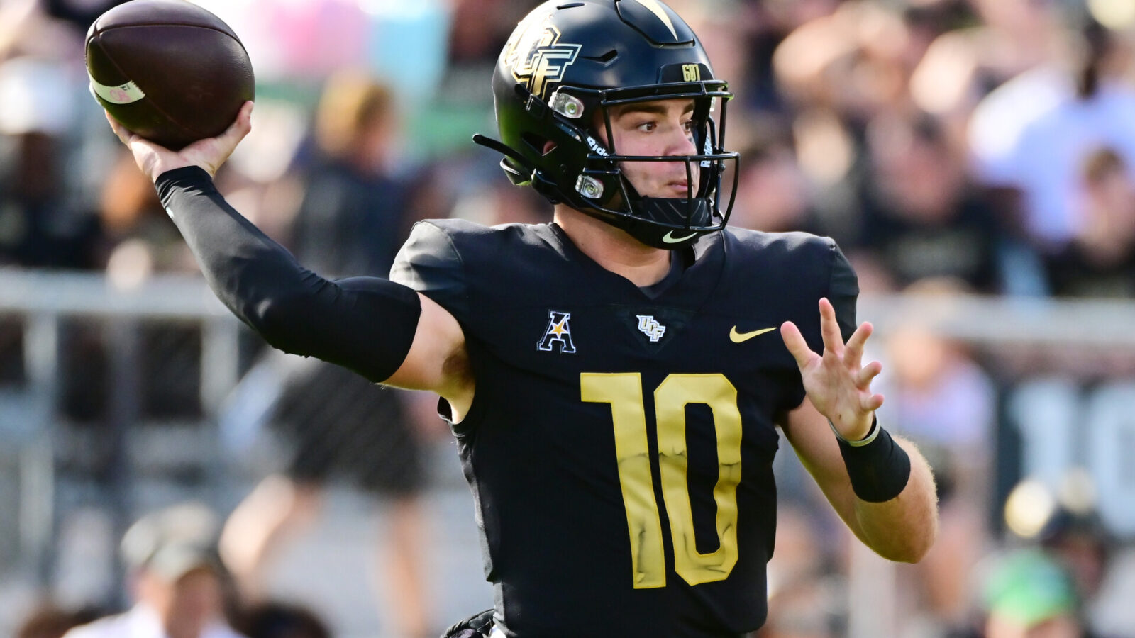 John Rhys Plumlee #10 of the UCF Knights looks to throw a pass during the first half of a game against the Cincinnati Bearcats at FBC Mortgage Stadium on October 29, 2022 in Orlando, Florida.