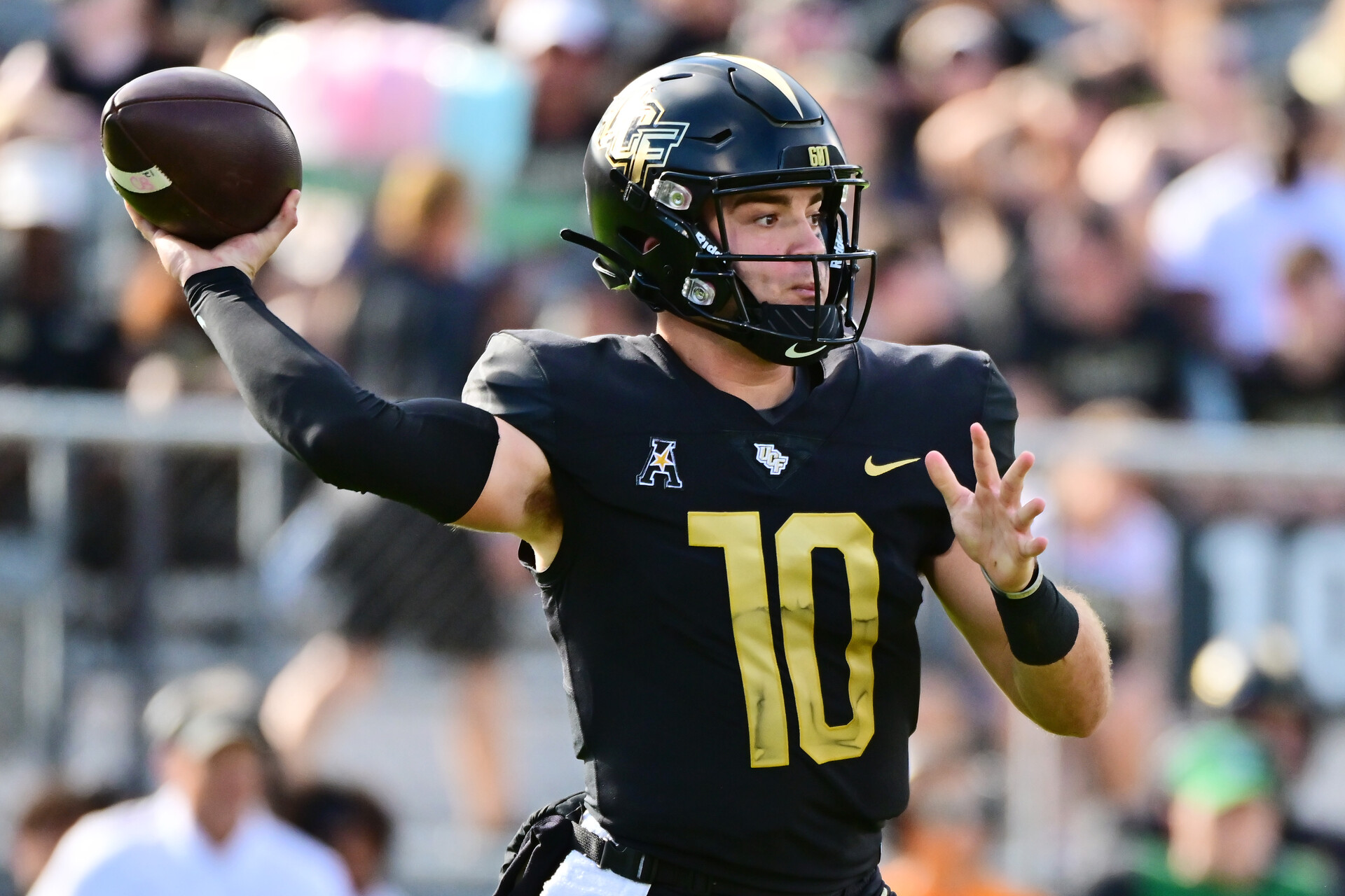 John Rhys Plumlee #10 of the UCF Knights looks to throw a pass during the first half of a game against the Cincinnati Bearcats at FBC Mortgage Stadium on October 29, 2022 in Orlando, Florida.