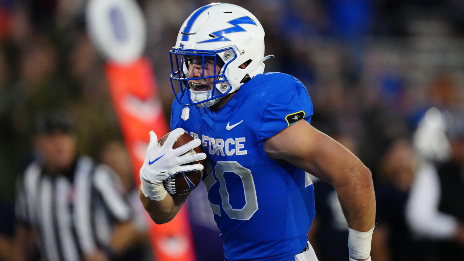 Air Force Falcons running back Brad Roberts (20) carries the ball in the second quarter against the Nevada Wolf Pack at Falcon Stadium.