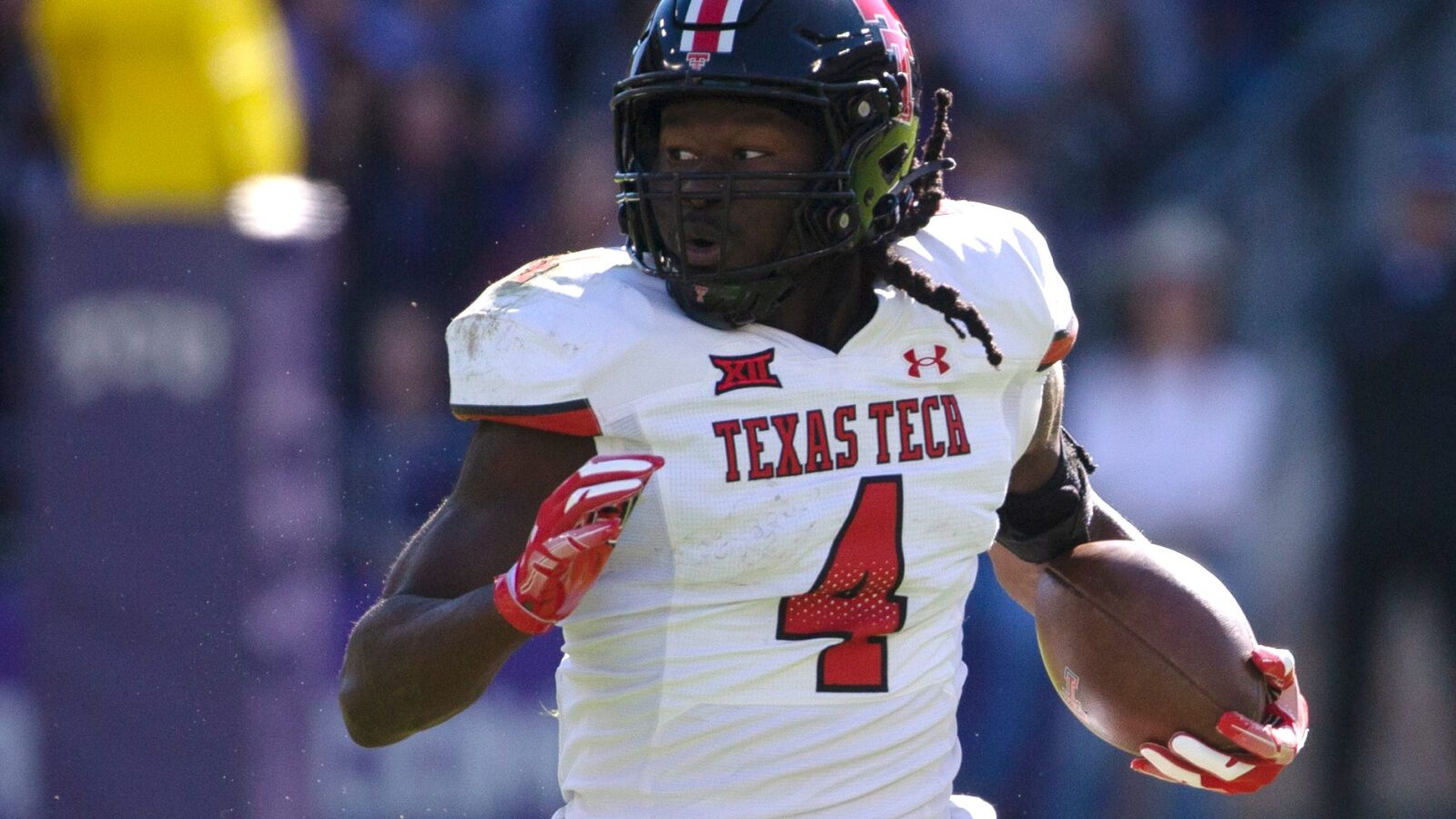Texas Tech's running back SaRodorick Thompson (4) runs with the ball against TCU in a Big 12 football game, Saturday, Nov. 5, 2022, at Amon G. Carter Stadium in Fort Worth.